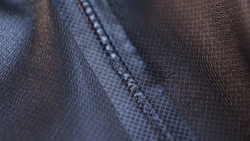 Close-up footage of waterproof clothing. Repellent waterproof breathable fabrics. High quality 4k footage