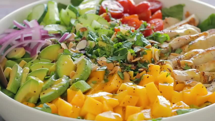 Chicken salad with fresh mango and avocado — healthy, vibrant, nutritious, refreshing meal perfect for lunch, light dinners, wellness bowls, clean eating, and gourmet salads.