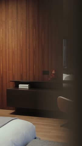 Stylish bedroom interior with beautiful wooden elements, an armchair and a large mirror. Vertical video