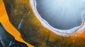 Flowing alcohol ink forms a vibrant abstract macro with orange and icy white tones - Powered by Shutterstock - Get 15% off with code: PIKWIZARD15