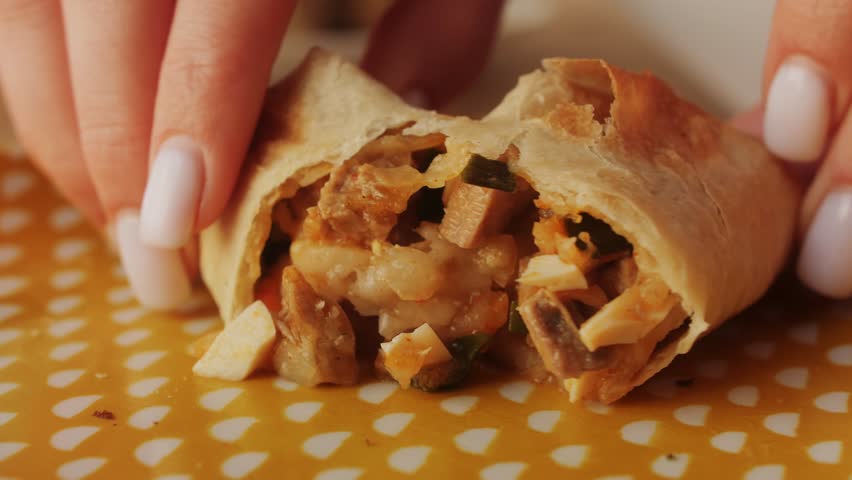 Woman eating empanadas argetinian pie, Samosa tart, traditional bakery from argentina, chef filling dough in home with meat and vegetables, homemade spanish empanadas