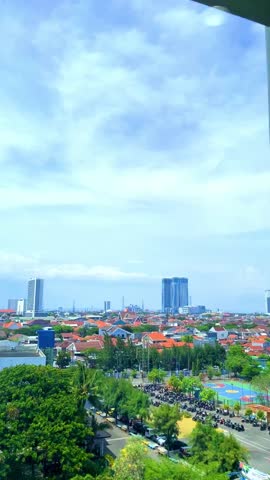Surabaya, one of Indonesia’s largest and most rapidly developing cities, is home to a growing skyline marked by modern high-rise buildings. Towering skyscrapers stretch above the bustling streets.