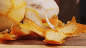 bartender makes a cocktail in a glass with orange peel, barman peeling orange or lemon.  - Powered by Shutterstock - Get 15% off with code: PIKWIZARD15