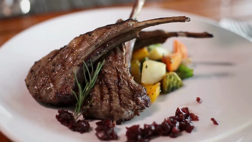 Exquisite rack of lamb with fresh rosemary and roasted vegetables