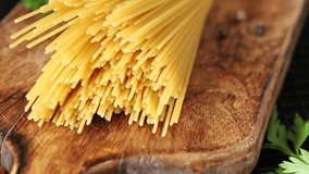 Spaghetti raw pasta food durum wheat ingredient fresh dish on the table rustic food top view copy space food background - Powered by Shutterstock - Get 15% off with code: PIKWIZARD15