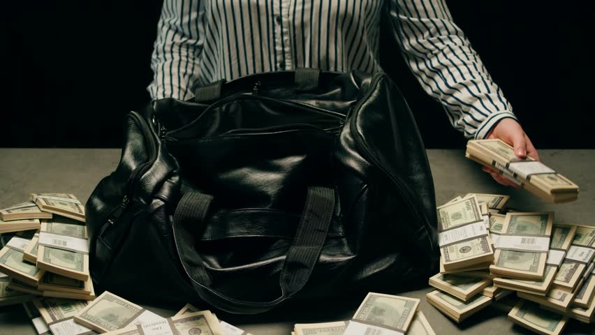 Banknotes and bag counter, Specialised police officer Counting dollar euro banknotes in crime lab with machine, cashed out criminal money, bitcoin changing, buying home flat in bank. 