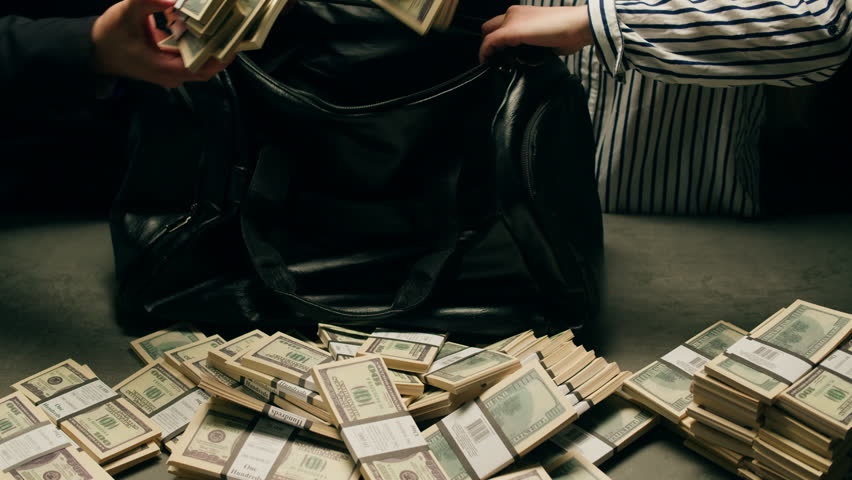 Banknotes and bag counter, Specialised police officer Counting dollar euro banknotes in crime lab with machine, cashed out criminal money, bitcoin changing, buying home flat in bank. 