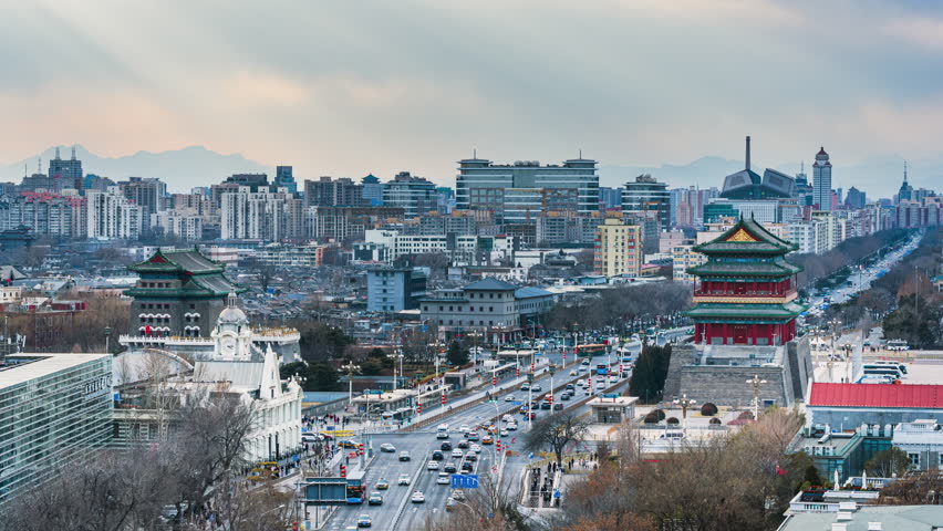 Urban scenery of the Drum Tower on the Central Axis and the Zhengyangmen Arrow Tower in Beijing, China, for travel holidays
