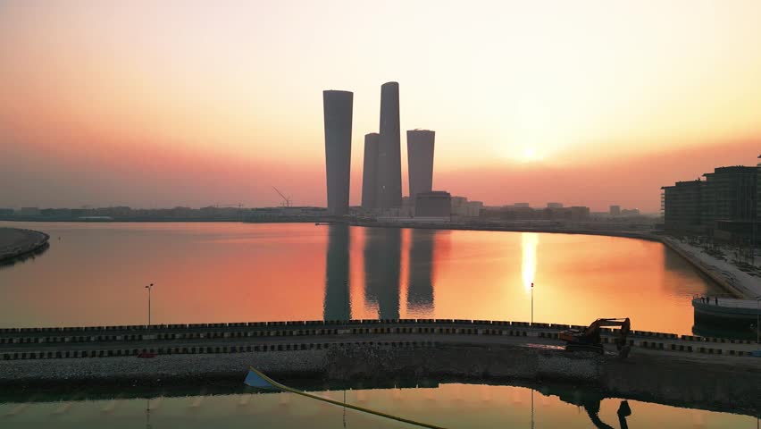 drone shot of lucail towers in qatar at sunset
