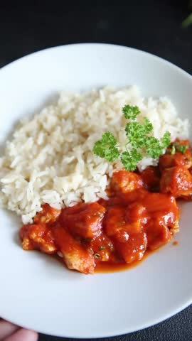 Rice butter chicken curry chicken tikka masala spicy meat in a bowl on the table fresh tasty gourmet food background on rustic food top view copy space