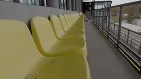 A row of bright yellow chairs in a stylish contemporary interior, blending design and comfort beautifully - Powered by Shutterstock - Get 15% off with code: PIKWIZARD15