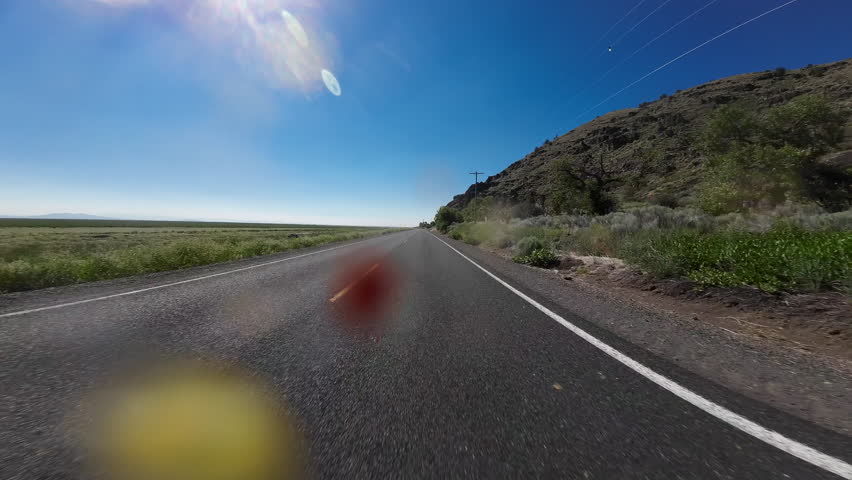 Tule Lake Mormon Crickets Swarm 05 Front View Driving Plates of Volcanic Legacy Scenic Byway Southbound California USA Ultra Wide