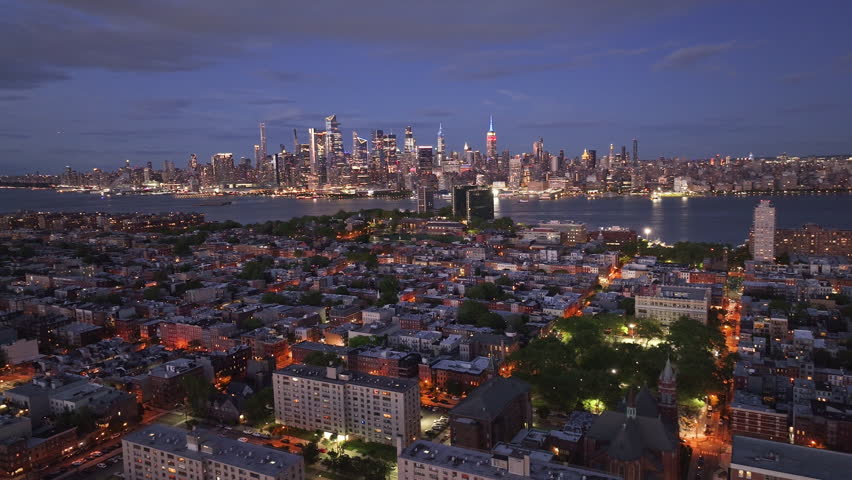 Aerial view of Hoboken, New Jersey at night. Shot with Midtown Manhattan in the background.