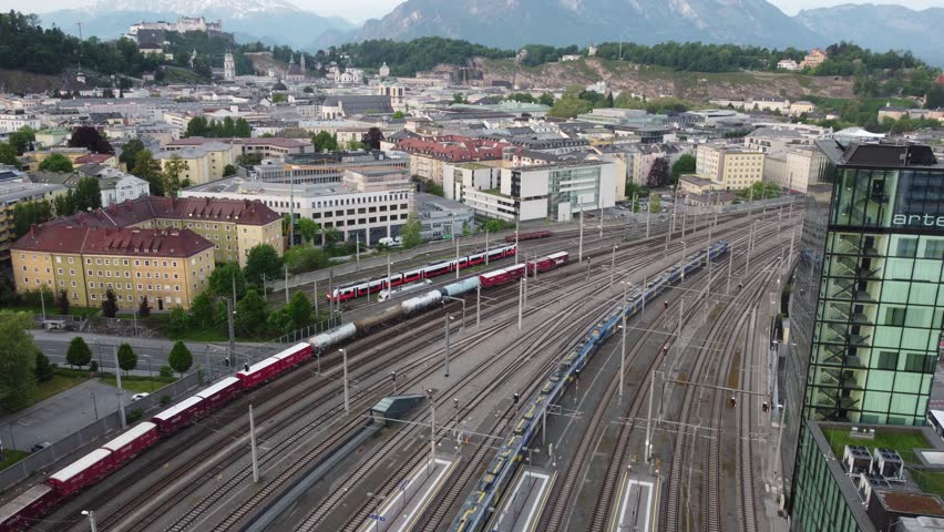 Salzburg Austria skyline of Salzburg HBF train station and town in 4k during sunset