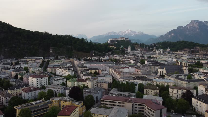 Salzburg Austria skyline of Salzburg HBF train station and town in 4k during sunset