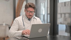Young Doctor Typing on Laptop in Clinic - Powered by Shutterstock - Get 15% off with code: PIKWIZARD15