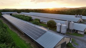 Solar panels installed on roof of barn building during golden sunset. Aerial flyover wide shot. Modern Rural farmstead in Pennsylvania,USA. Peaceful countryside farm in United States. - Powered by Shutterstock - Get 15% off with code: PIKWIZARD15