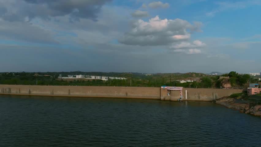 Panoramic View of a Reservoir Dam and Surrounding Landscape