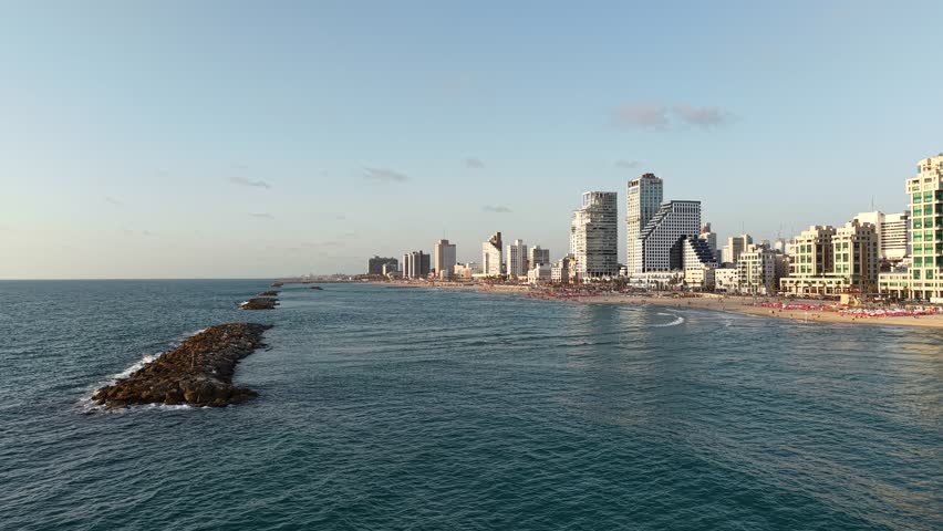 Aerial video of the coastline and promenade of the city of Tel Aviv