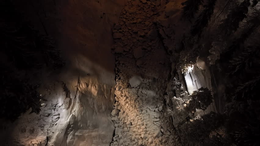 Aerial tilt shot toward the Imatrankoski dam, winter evening in Imatra, Finland