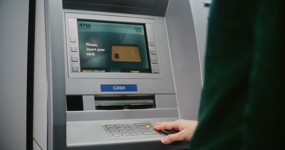 ATM User Entering PIN Code on ATM Keypad for Money Withdrawal. Error Message on Cash Machine Screen About Cancelled Transaction Due to Blocked Bank Account. Cash Transactions, Banking System. Close Up