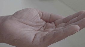 Many pills fall into hand, slow motion - Powered by Shutterstock - Get 15% off with code: PIKWIZARD15