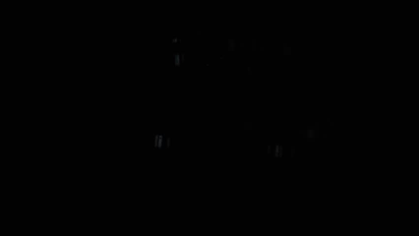 Light bulbs that glow in the dark sway from side to side. Light in the dark.