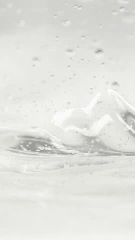 Cosmetics serum gel background, transparent cream texture, facial mask treatment