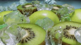 Close-up of Kiwi and Apple Halves with Ice, Water Splashes Flying on Green Background. Refreshing Summer Drink. 4K Slow Motion Video - Powered by Shutterstock - Get 15% off with code: PIKWIZARD15