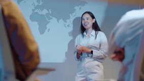 young Asian software development manager leads a late-night office discussion with his executive team, mentoring developers and analyzing source code to guide programming and project development - Powered by Shutterstock - Get 15% off with code: PIKWIZARD15