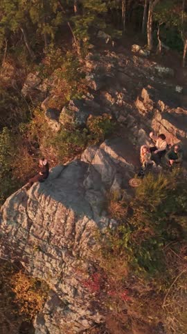 Aerial view of hikers on rocky outcrop at Buffalo Mountain near Johnson City Tennessee USA vertical screen
