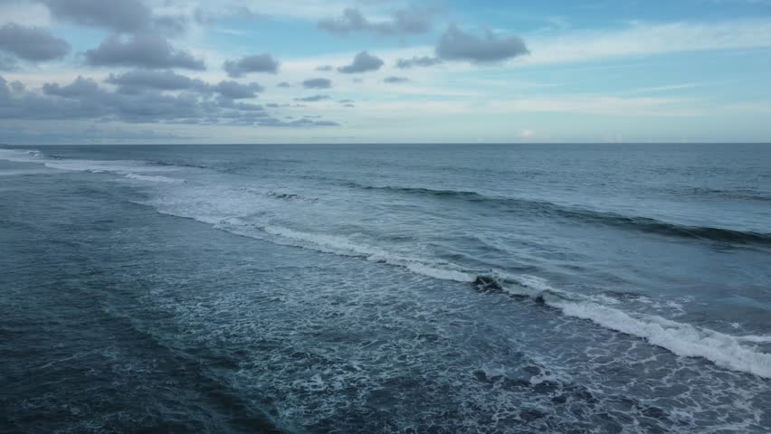 Mesmerizing ocean waves sandy shoreline aerial top view. Expanse ocean majestic waves sandy beach serene retreat Waves caress ocean edge beauty oceanic coast tranquility of coastal landscape.