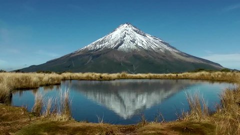 Reflections of the mountain in a lake , Mt Egmont, Taranaki, New Zealand