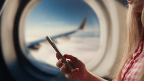 Using phone and tablet pc on airplane in air, Hands of traveller using smartphone for connecting, using app. Tourist waiting for boarding for vacation in airport. Green screen concept. - Powered by Shutterstock - Get 15% off with code: PIKWIZARD15