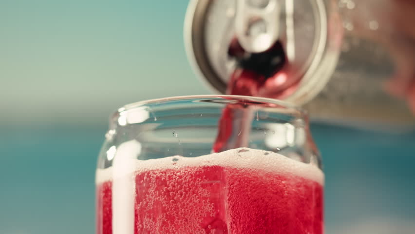 Opening soda or beer can, macro close up of can pull tab opening, watering refreshment, hand open lemonade or juice.