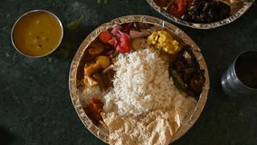 Close up view of a traditional Bihari lunch plate featuring dal, steamed rice, seasonal sabji, and fresh salad. Indian common man food - Powered by Shutterstock - Get 15% off with code: PIKWIZARD15