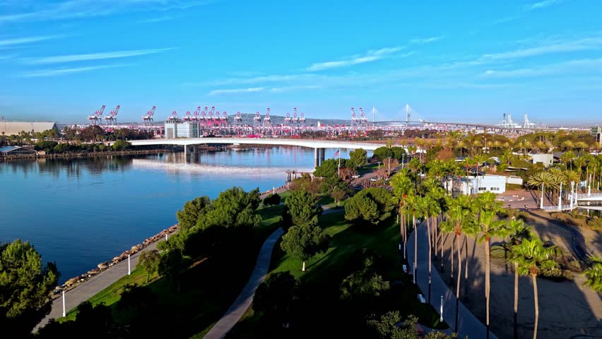 Tranquil beauty of Lions Lighthouse and ShoreLine Aquatic Park in Long Beach, CA at dawn with calm waters creating perfect reflections