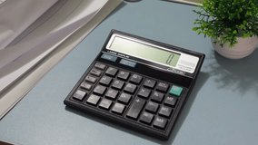 Woman hands using calculator. Pressing calculator buttons analyzing business income. Accountant working at table with documents bills money cash - Powered by Shutterstock - Get 15% off with code: PIKWIZARD15