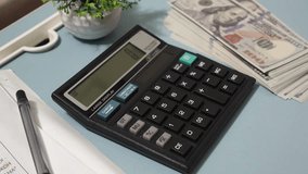 Woman hands using calculator. Close up female accountant managing household monthly budget summarizing taxes accompanied by notes and currency. - Powered by Shutterstock - Get 15% off with code: PIKWIZARD15