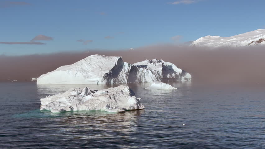 Big Iceberg in Antarctica Winter Scenery, Amazing Shape Ice Formation of Massive Large Enormous Blue Icebergs in Antarctic Peninsula Landscape Seascape with Ocean Sea Water