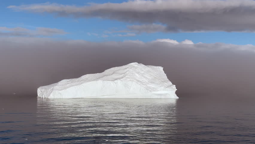 Big Iceberg in Antarctica Winter Scenery, Amazing Shape Ice Formation of Massive Large Enormous Blue Icebergs in Antarctic Peninsula Landscape Seascape with Ocean Sea Water