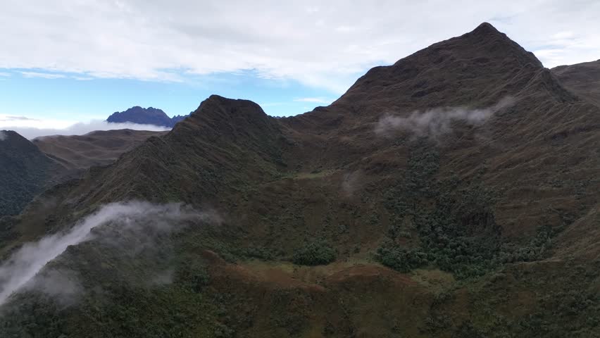 Flying above the clouds. Aerial view of clouds at sunrise. Perfect deep air travel. Peru near Machu Picchu