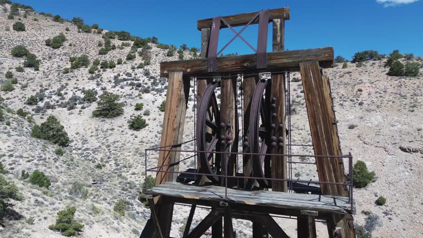 Horn Mine near Milford, Utah. Rotating pan shot of the top of the head frame, featuring the massive pulleys and catwalk.