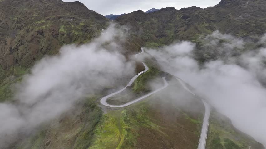 Cinematic roads in the Andes, aerial view above the clouds. Peru near Machu Picchu.