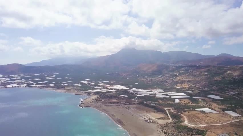 Aerial View of Coastal Town and Mountain Landscape
