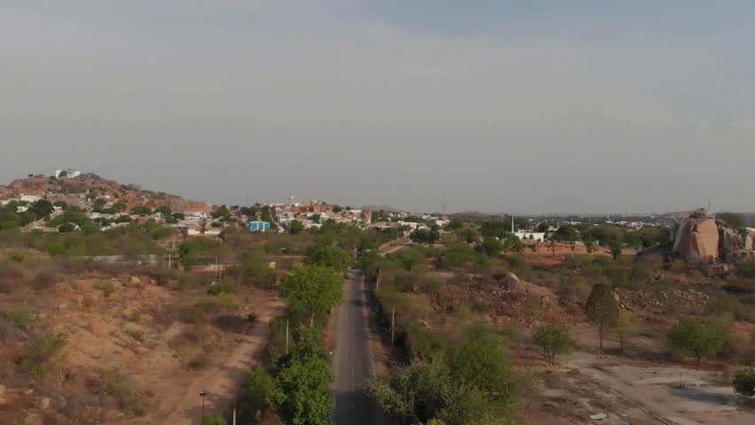Aerial View of Suburban Landscape with Hills and Road
