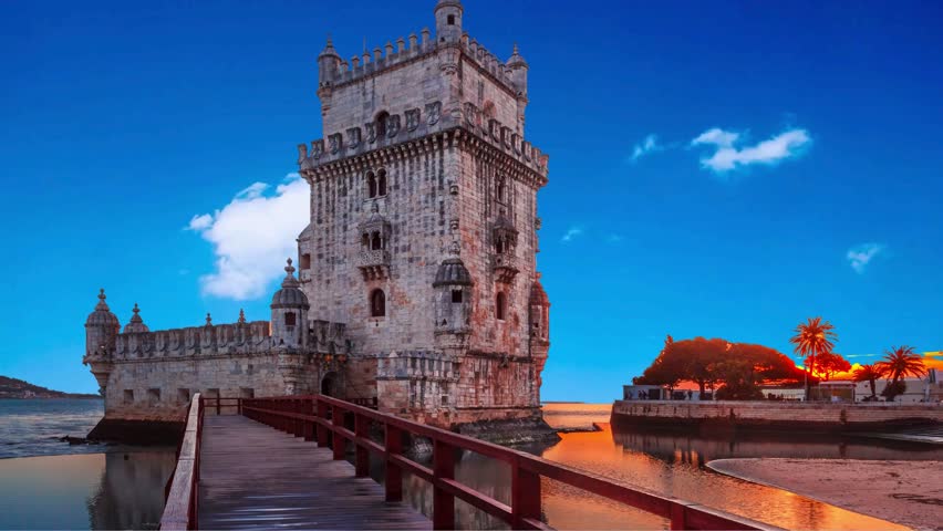 Belem Tower or Tower of St Vincent - famous tourist landmark of Lisboa and tourism attraction - on the bank of the Tagus River (Tejo) after sunset in dusk twilight with dramatic sky. Lisbon, Portugal