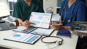 Medical team working with a tablet and Laptop computer search for medical information at the hospital office. - Powered by Shutterstock - Get 15% off with code: PIKWIZARD15