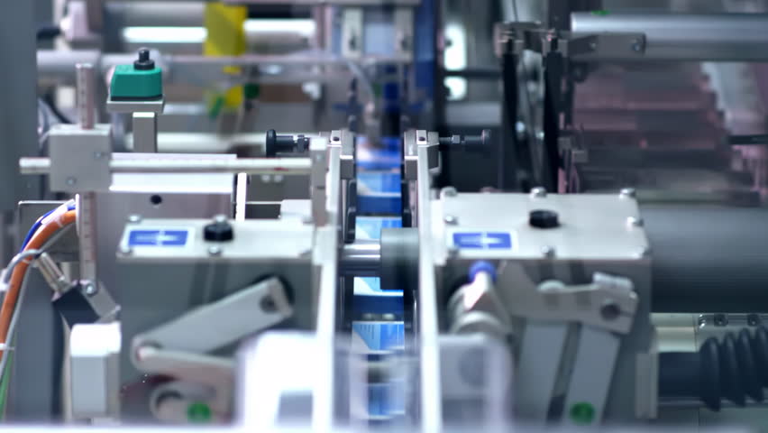 A clean and organized modern medical pharmacy during Automated biopharmaceutical manufacturing packaging line for pharmaceutical products in a factory setting Factory healthcare products