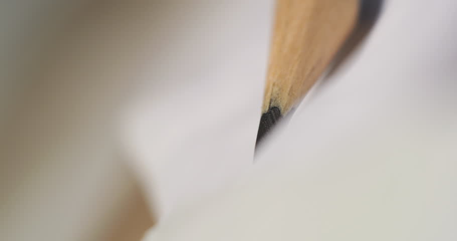 Close-up tracking shot of graphite pencil creating detailed sketch. Stabilized match move technique follows smooth strokes on paper surface.